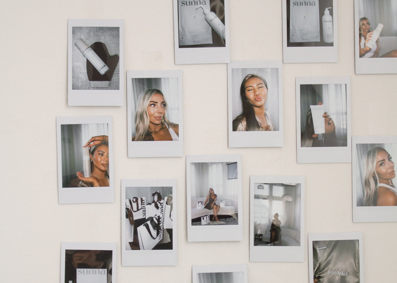 Grid of framed photographs on a wall